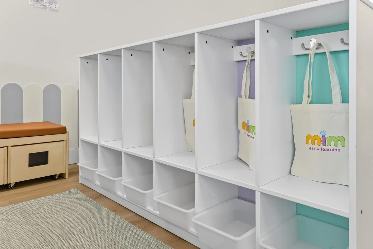 Children's cubbies with MIM tote bags by the entrance