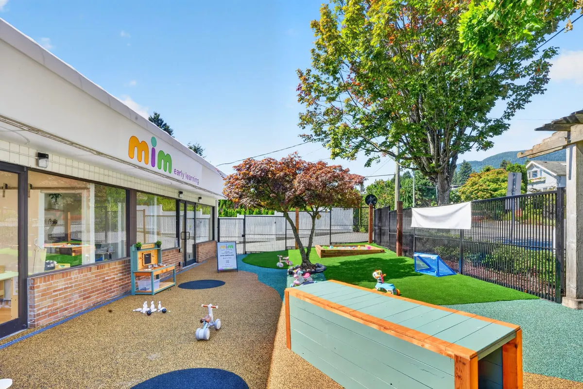 Fenced outdoor area and entrance path at MIM Early Learning