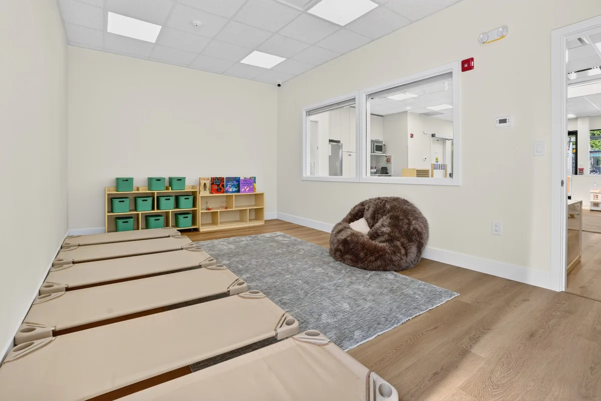 Calm rest room with nap cots, a soft rug and a bean bag