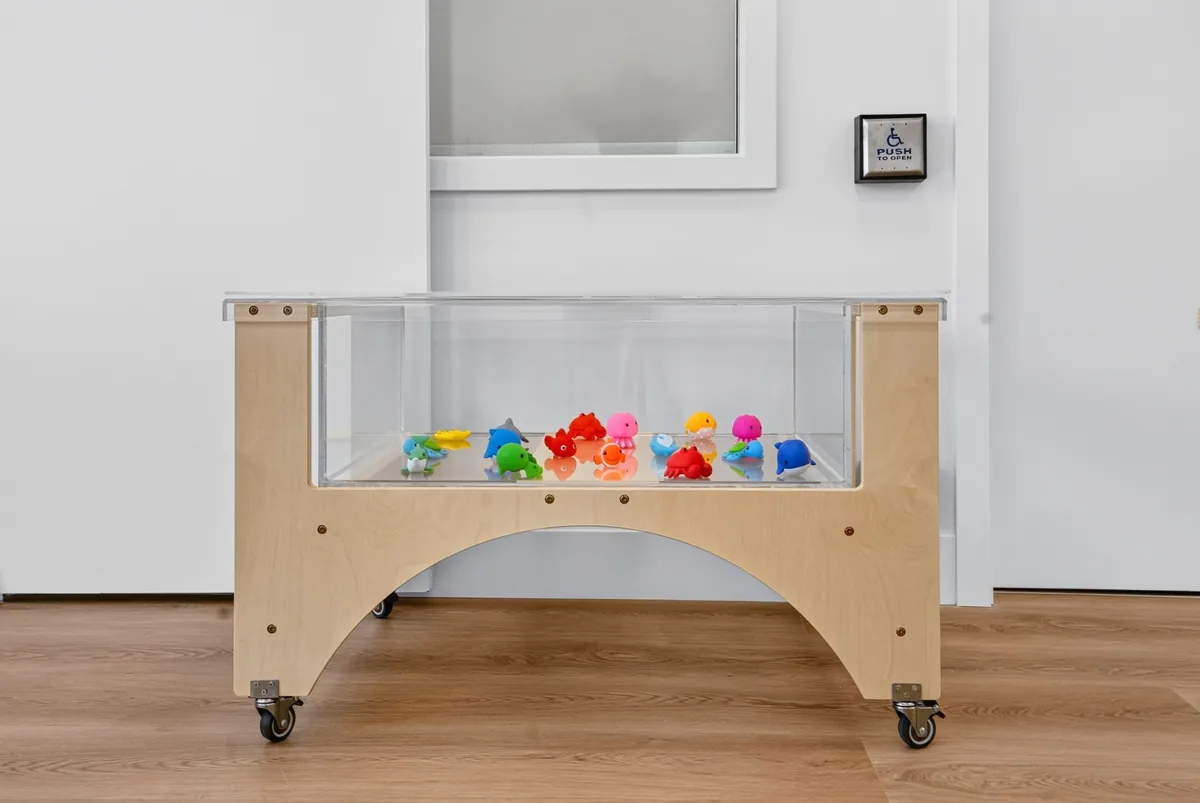 Sensory water table filled with colourful sea-creature toys